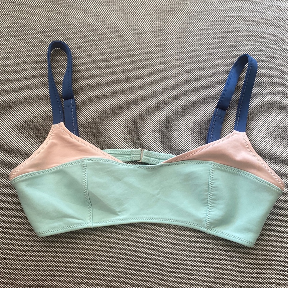Adorable sports bra with thick straps.